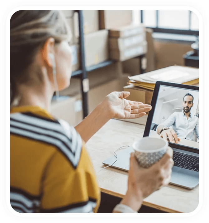 A client having an online video session with a coach